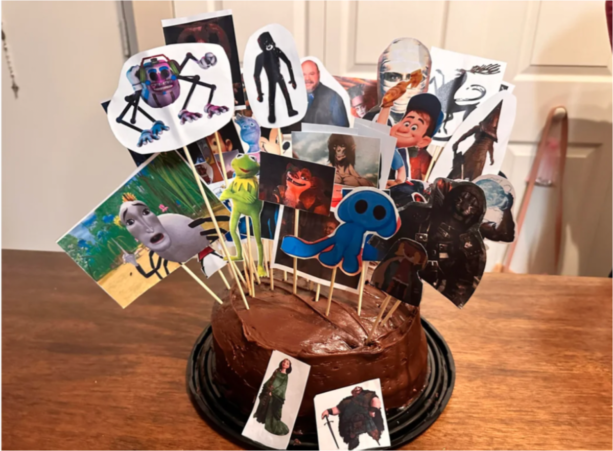 This photo, (courtesy of [Dani Placido) shows what a typical "hear me out" cake would look like. It's a flat, frosted cake covered with images of characters stuck on wooden rods. Each of the characters / images could be considered a "hear me out" by the cake's maker. 